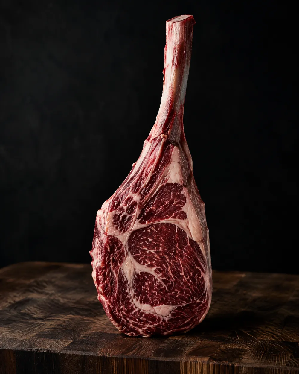 Raw tomahawk steak on the bone